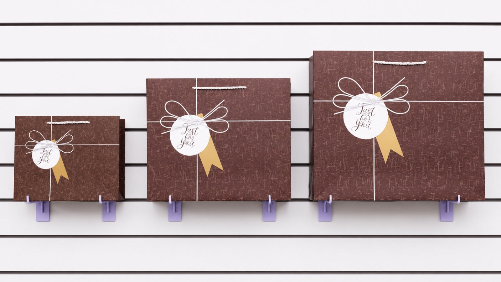 Bolsas de regalo modelo 503 con diseño elegante y moño decorativo. Disponibles en tamaños chica, mediana y grande. Importación directa ROGLUX.